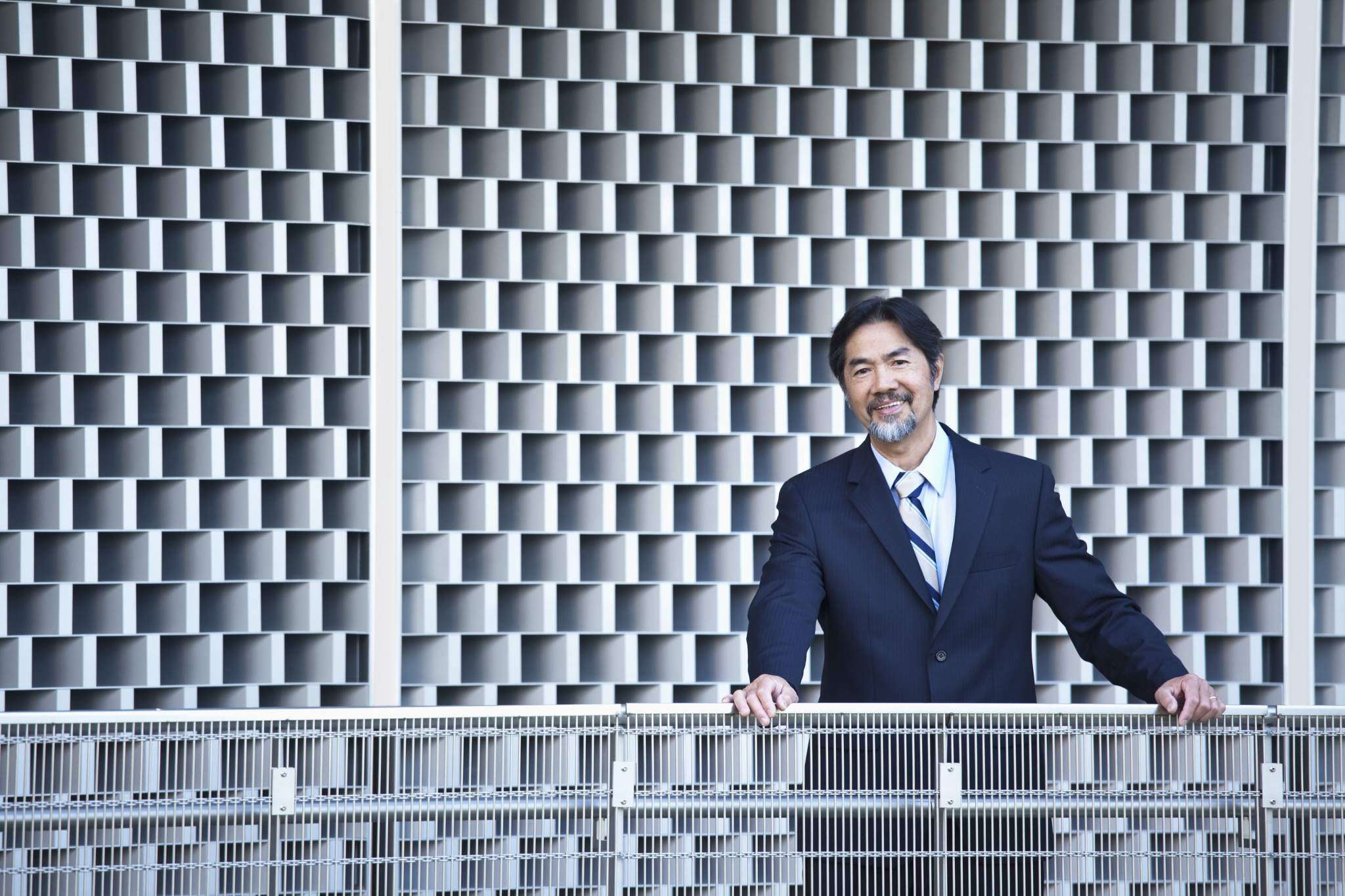 Photograph Smiling Japanese businessman stan